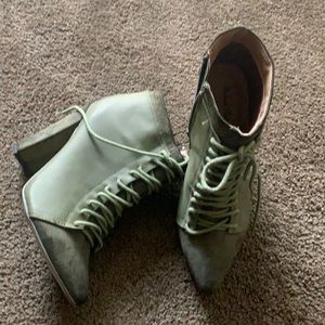 Olive green tie bootie with side zip. Faux suede details. Worn once. No box.